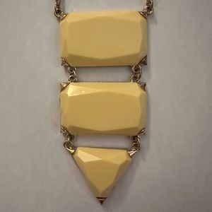 Francesca’s gold long necklace with yellow geometric detailing